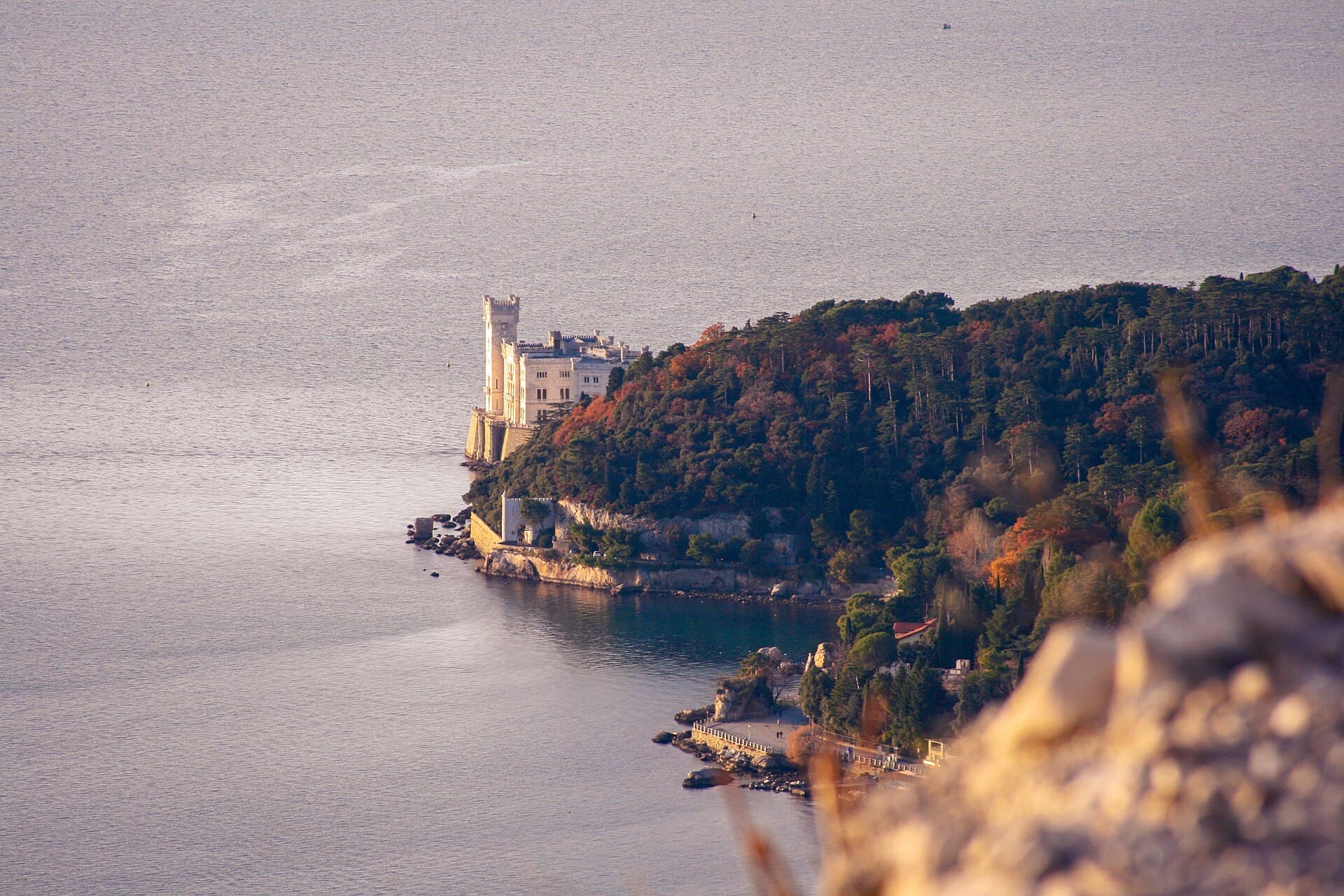Miramare Castle on its headland: the museum is ticketed, the park around it free but closing early in winter.