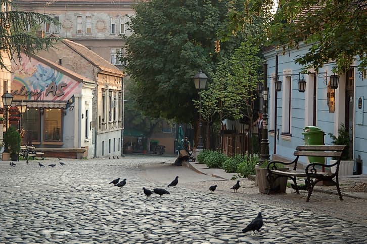 Skadarlija at dawn: the cobbles of the bohemian street before the kafanas open.