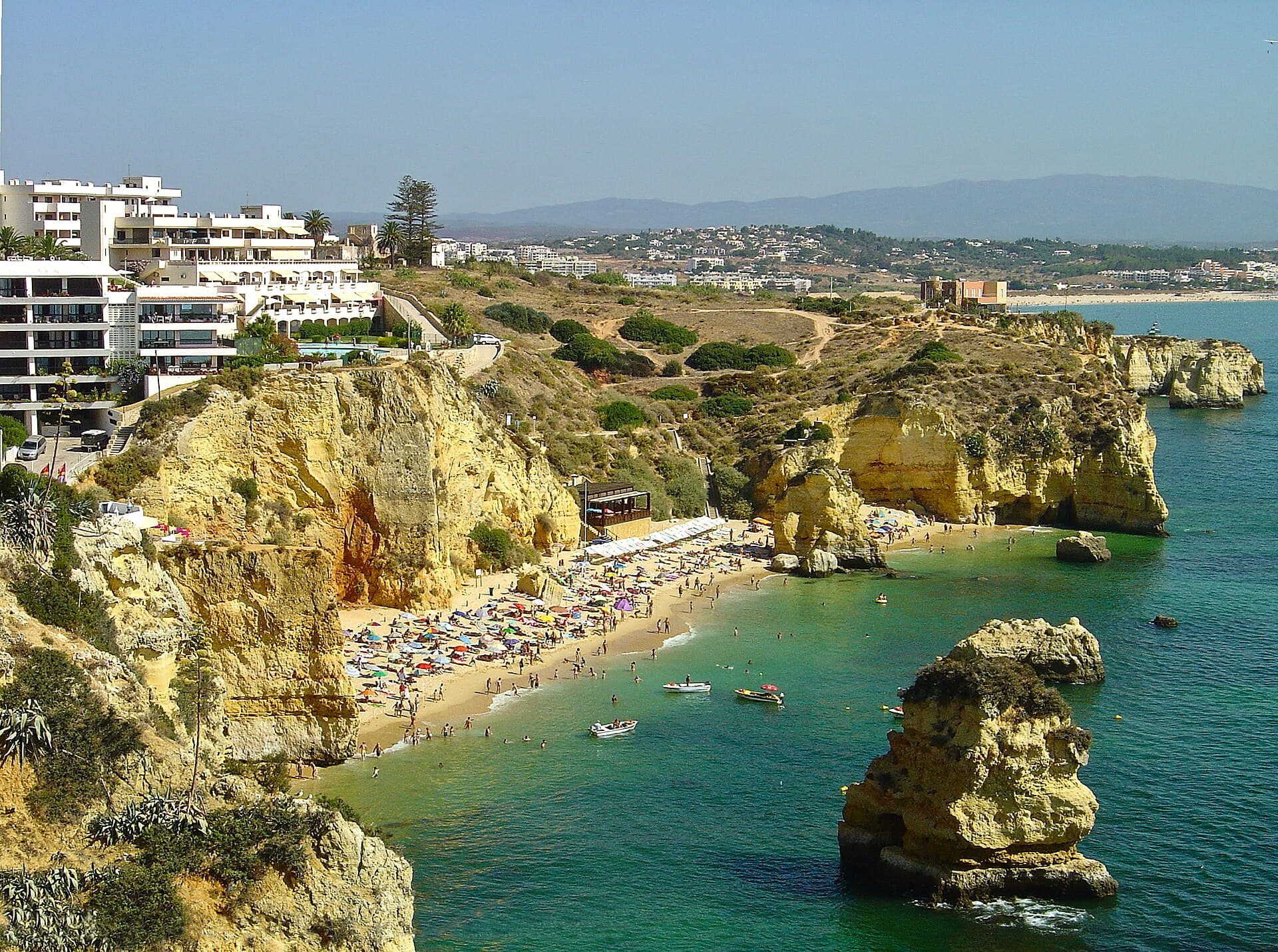 Praia Dona Ana between its honey-coloured cliffs: Lagos's postcard beach, best enjoyed early in the morning in summer.